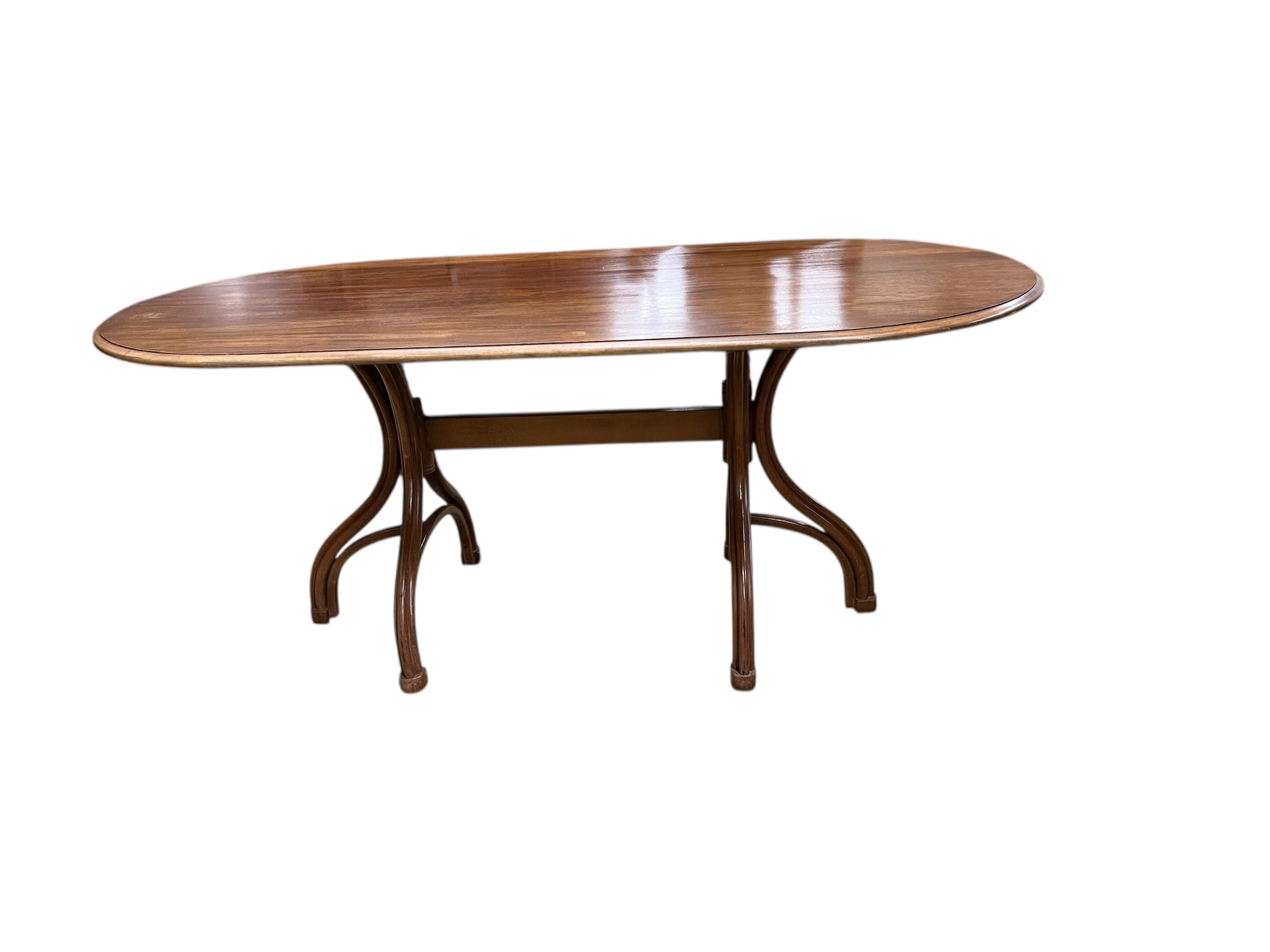 A Dinette caned beech and mahogany bentwood dining suite, comprising: dining table, width 180cm, depth 90cm, height 76cm and six elbow chairs